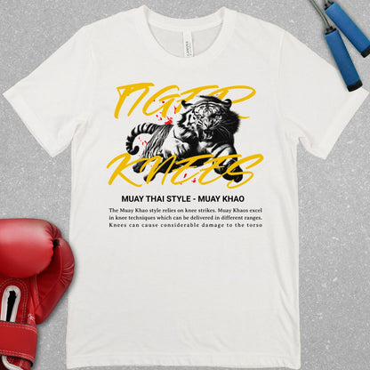 White shirt with a design that has a tiger and says Tiger Knees. There is also text explaining the Muay Khao style of Muay Thai