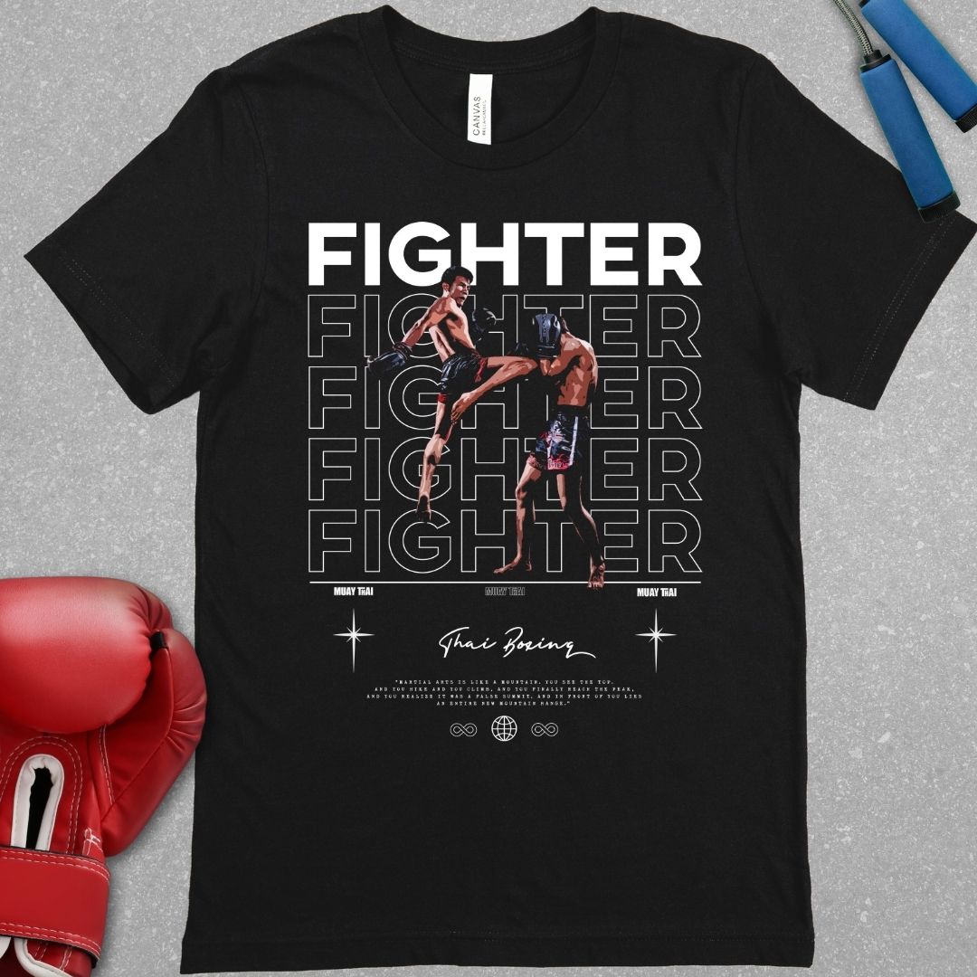 Black shirt with a design of a Muay Thai fighter throwing a knee to another Muay Thai fighter. The word fighter is highlighted on the shirt and the words Thai Boxing are also on the shirt underneath the picture of the Muay Thai fighters.