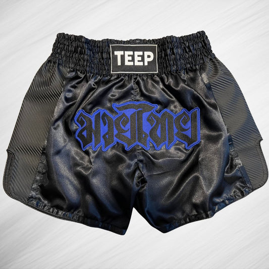 Black Muay Thai shorts with the word Teep on the waistband and Muay Thai in Thai writing on the front