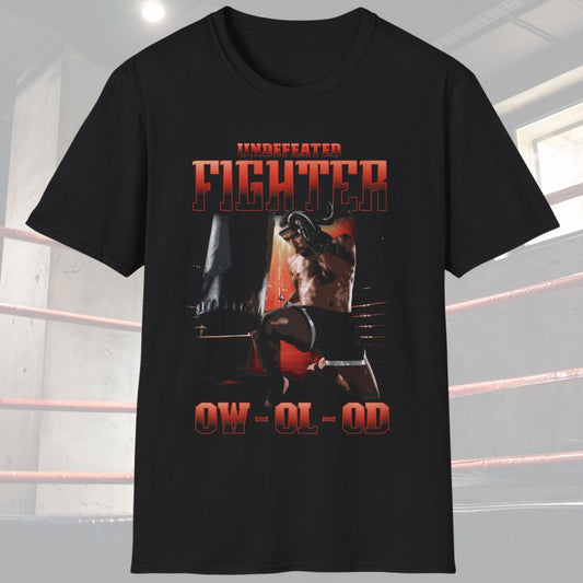 Black shirt with a design that has the words undefeated fighter at the top of the design and 0W 0L 0D at the bottom of the designs. The design has a fighter throwing a flying knee at the Muay Thai bag.