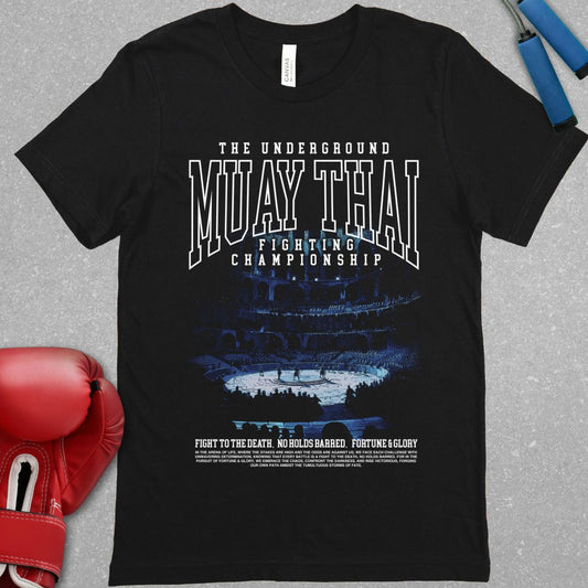 Black shirt with a muay thai related design. The design has text at the top that says The Underground Muay Thai Fighting Championship and there is a picture of the colosseum.