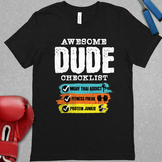 Black shirt with text that says Awesome Dude Checklist – Muay Thai addict – Fitness Freak – Protein Junkie