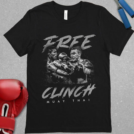 Black shirt that has a design of two Muay Thai fighters clinching with one of the Muay Thai fighters throwing an elbow in the clinch. The design also contains the phrase Free Clinch and has the words Muay Thai at the bottom of the design.