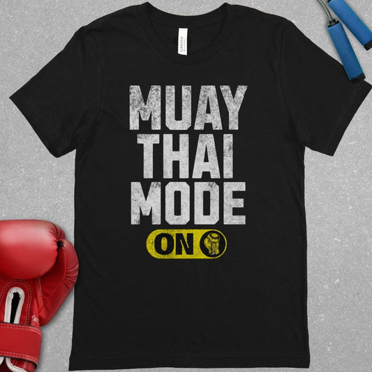 Black shirt with a design that says Muay Thai Mode On.